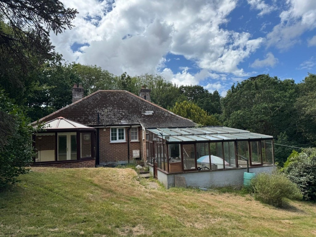 Lot: 140 - CHALET BUNGALOW ON ONE ACRE PLOT IN SEMI-RURAL LOCATION - View of the rear